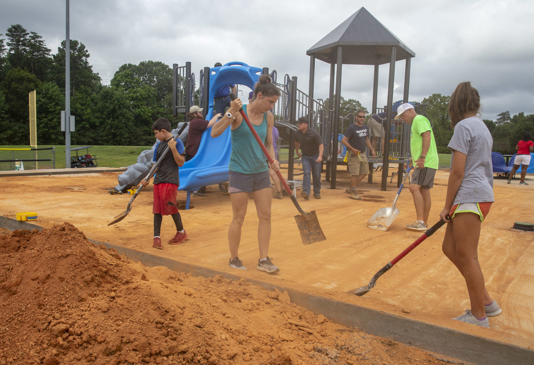 Volunteers assemble playground